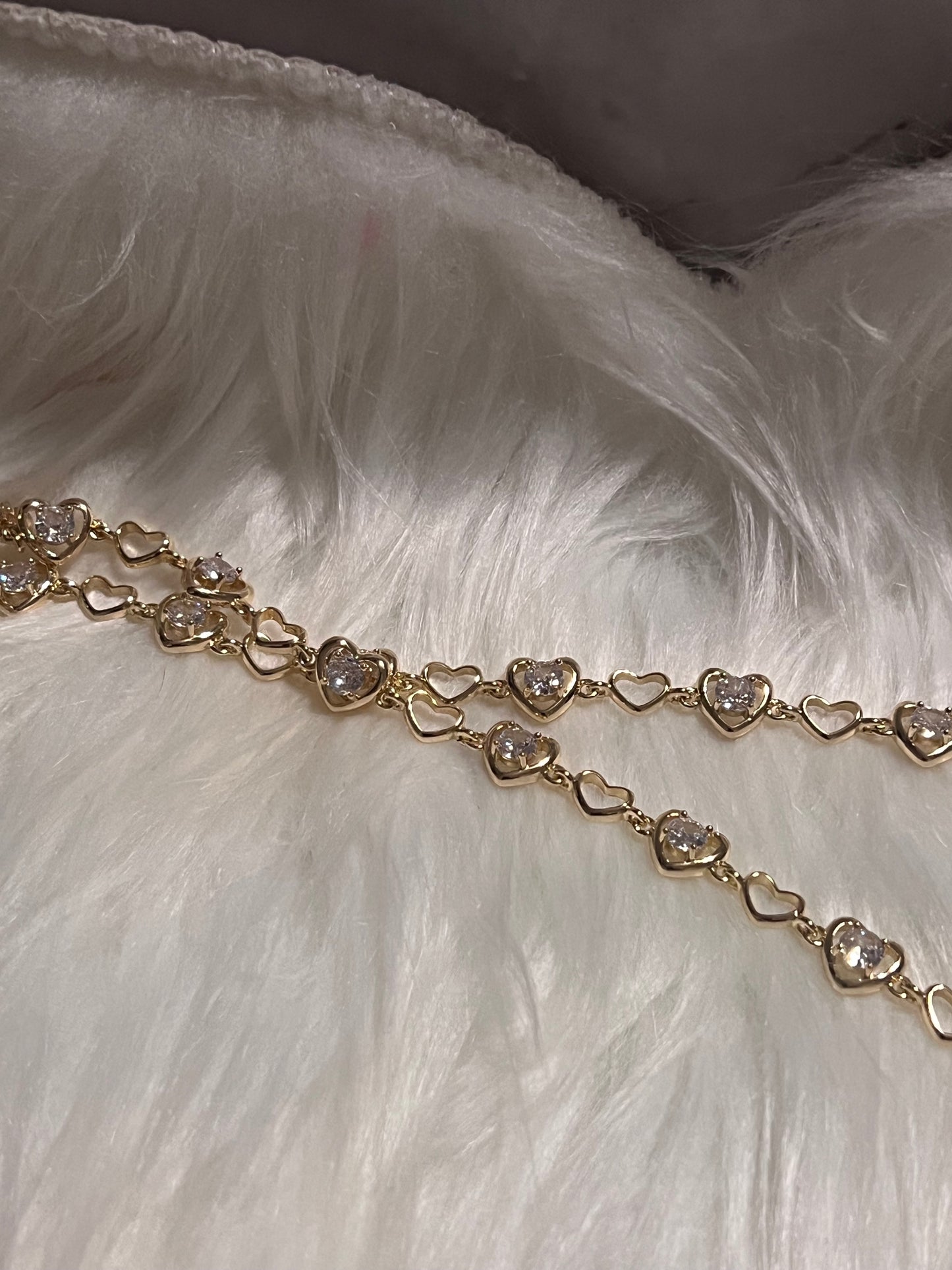 Pulsera de tenis con corazón de oro