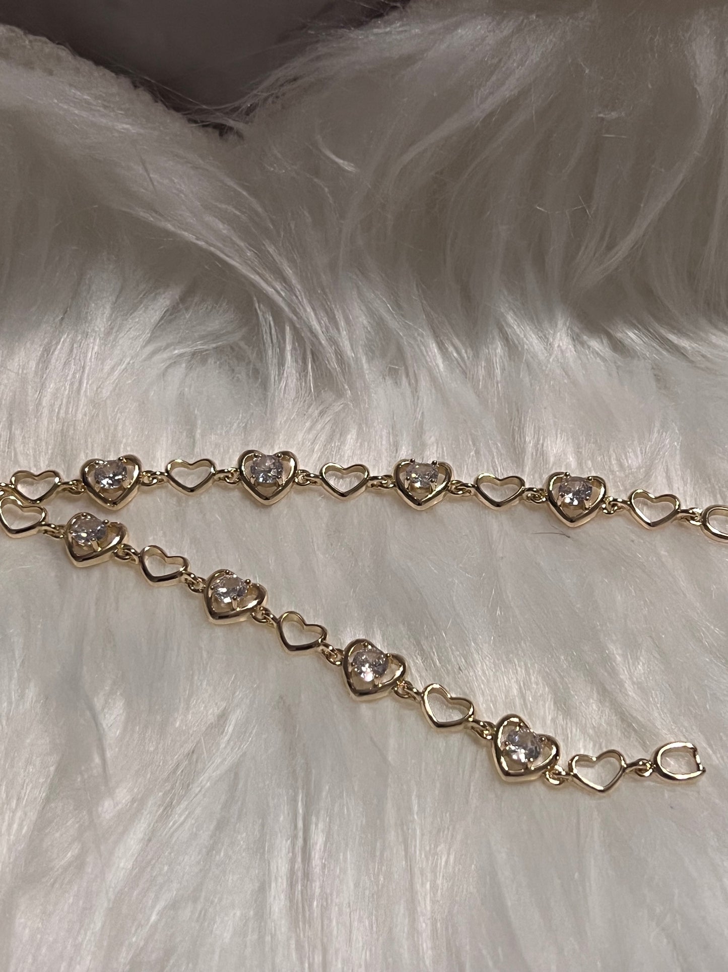 Pulsera de tenis con corazón de oro