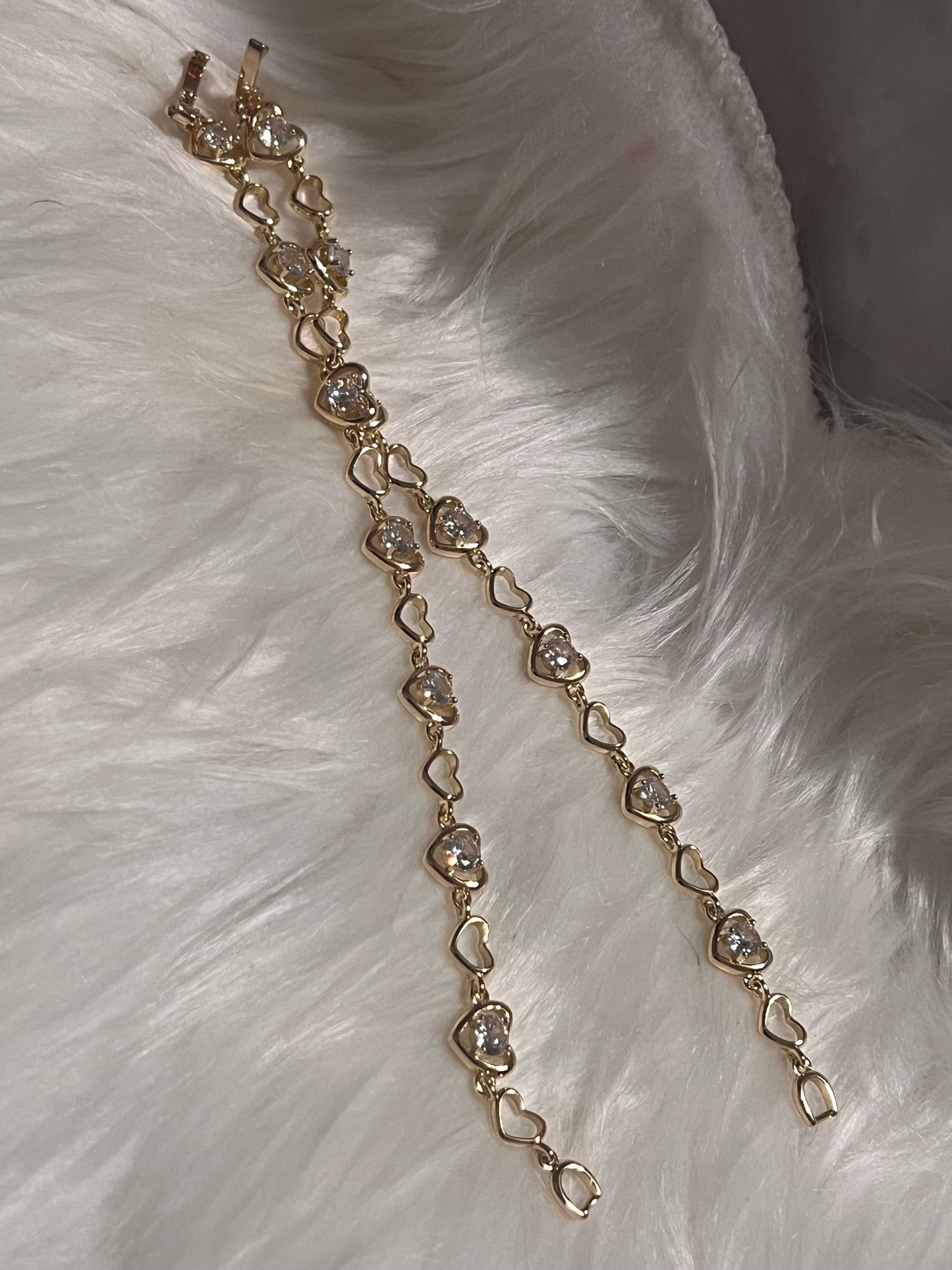 Pulsera de tenis con corazón de oro