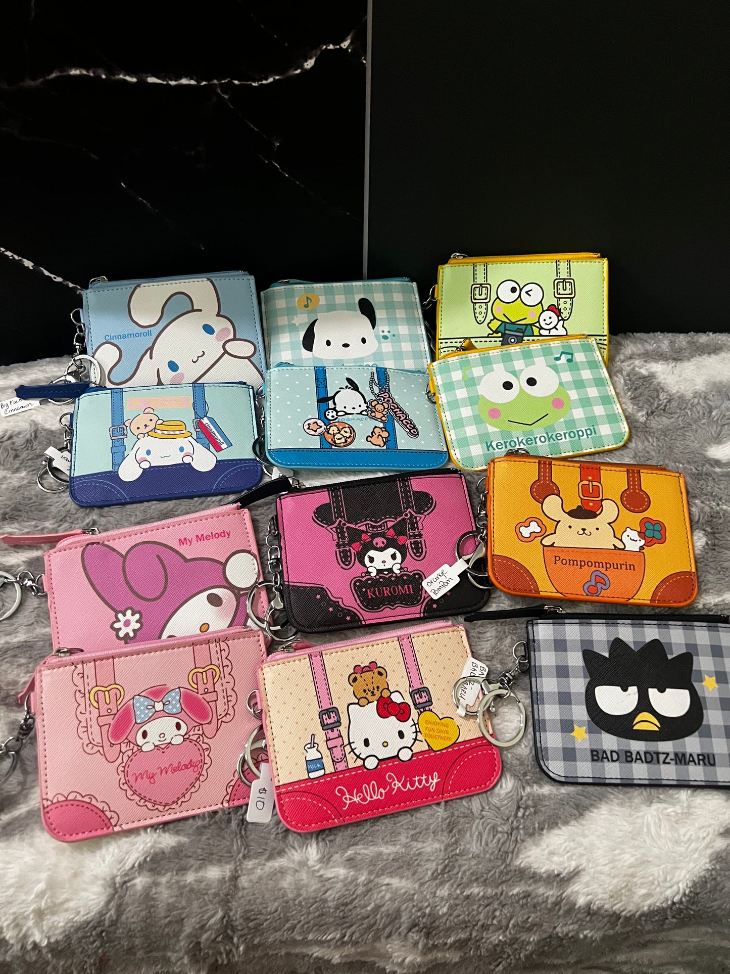 Monederos con llavero de la familia Sanrio