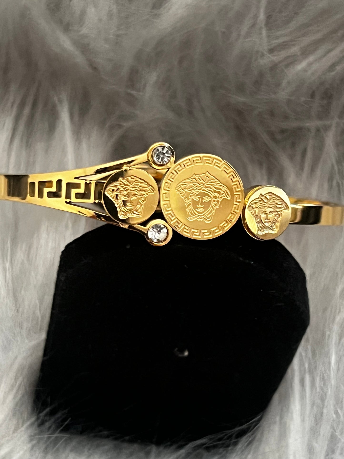 Elegant Gold-Tone Bangle with Embedded Stones