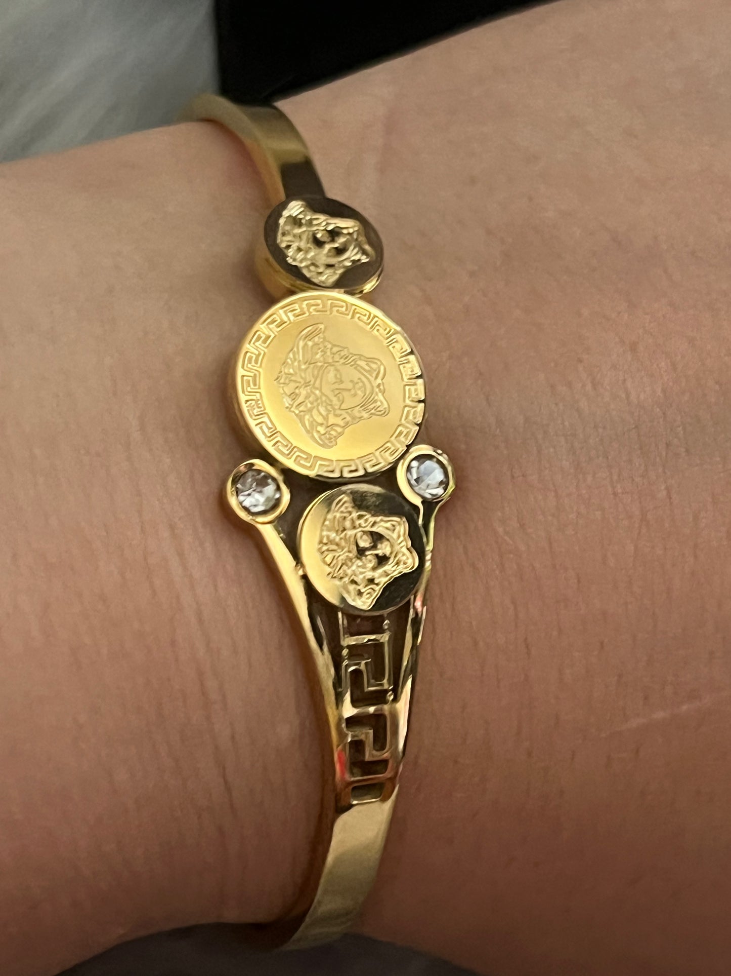 Elegant Gold-Tone Bangle with Embedded Stones