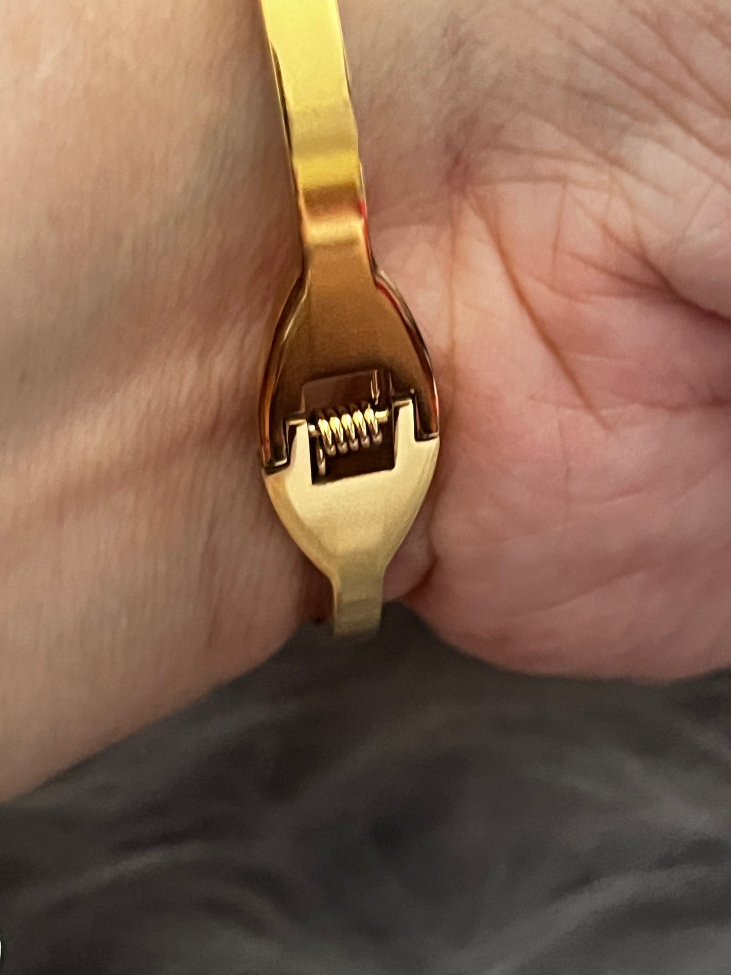 Elegant Gold-Tone Bangle with Embedded Stones